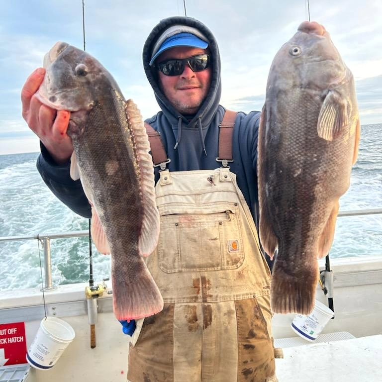 a man holding a fish