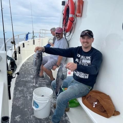 a man holding a fish